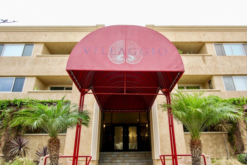 In the Coverage to the parkway of Villaggio has red color shield and has plants on both sides
