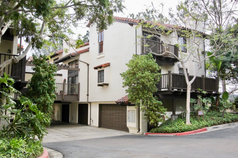 Large brown garage door near mail boxes in Villas Malllorca in La Jolla CA
