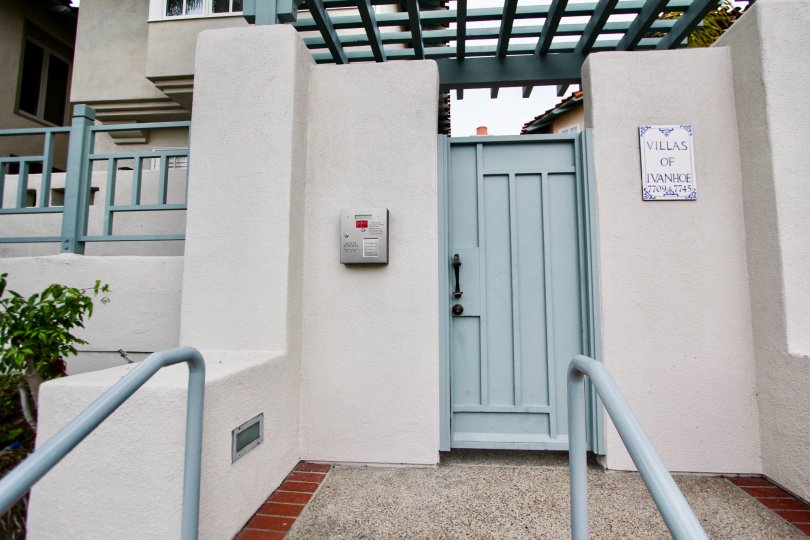 blue door in front of a blue railing inside villas of ivanhoe in la jolla ca