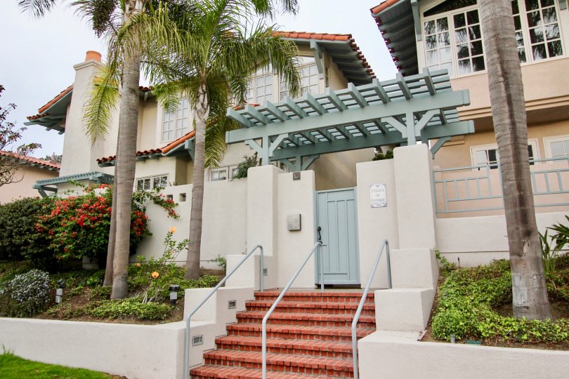 Awesome view of a villa with lawn and palm trees in Villas of Ivanhoe of La Jolla