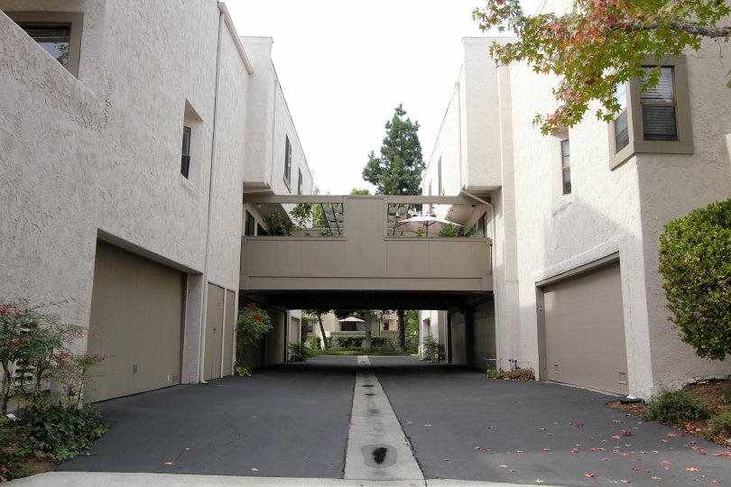 black driveway with storm drain in the middle inside woodlands west ii in la jolla ca