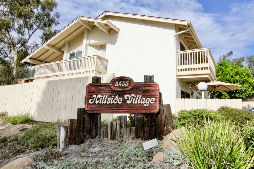 The Board in Hillside Village marked Hillside Village with 5455 number between bushes