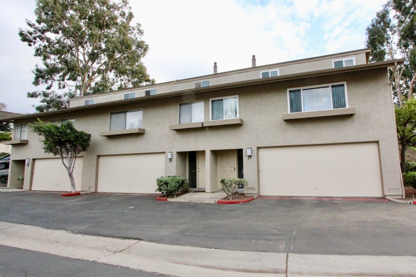 the La Mesa Racquet & Swim Club is wide and small plants in the front side