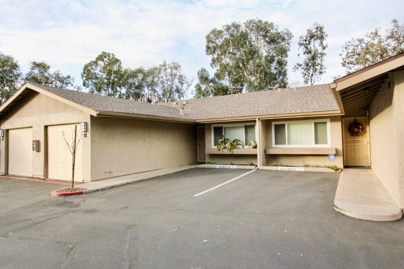a warm day in the la mesa racquet & swim club with a building that has no roof top