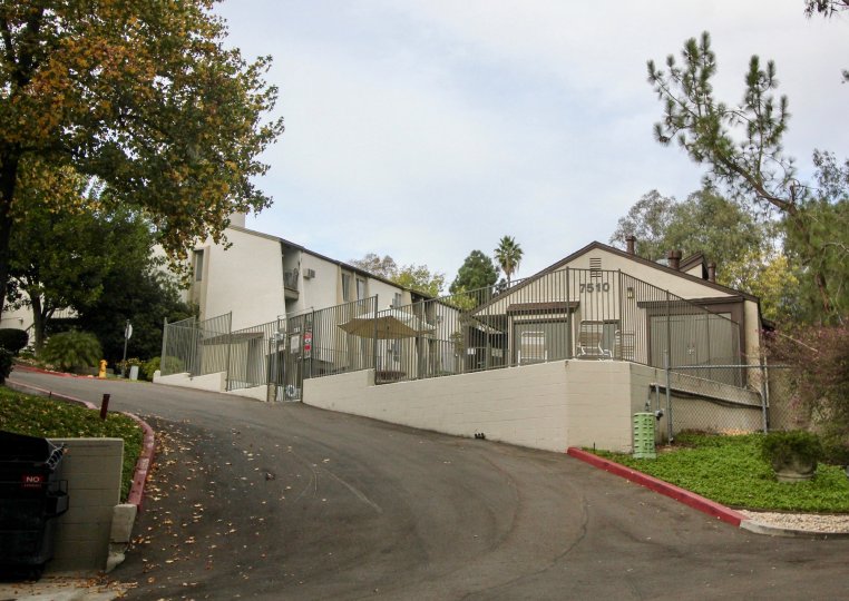 THE 7510 APARTMENT IN THE PARKWAY POINTE WITH THE UMBRELLA, TREES, THAR ROAD