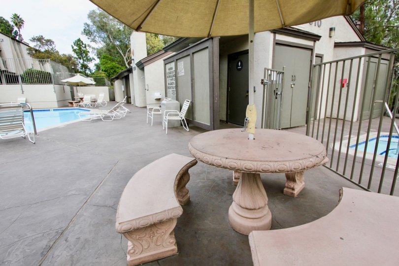 the Parkway Pointe with tables and chairs near to the swimming pool