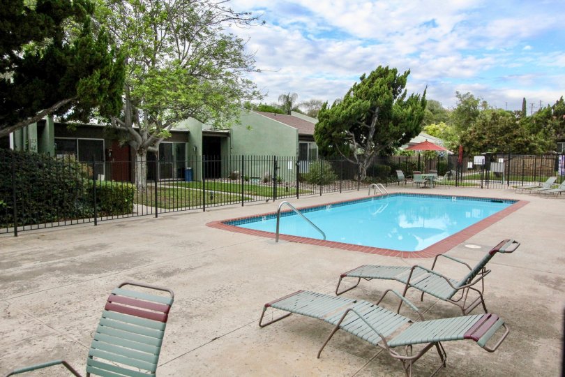 A beautiful day at Villa Mesa Parks in La Mesa with a pool in the courtyard.