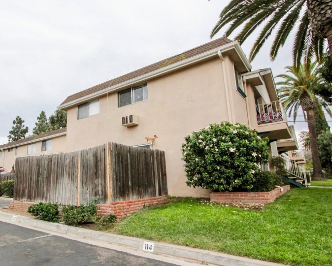 a pleasant day in the westwood village with a house that has wooden patition at its side