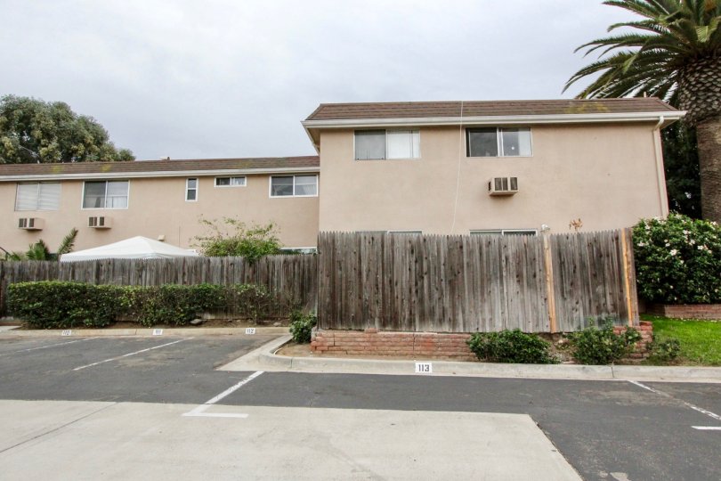 Cloudy day with trees around and parking in Westwood Village of La Mesa