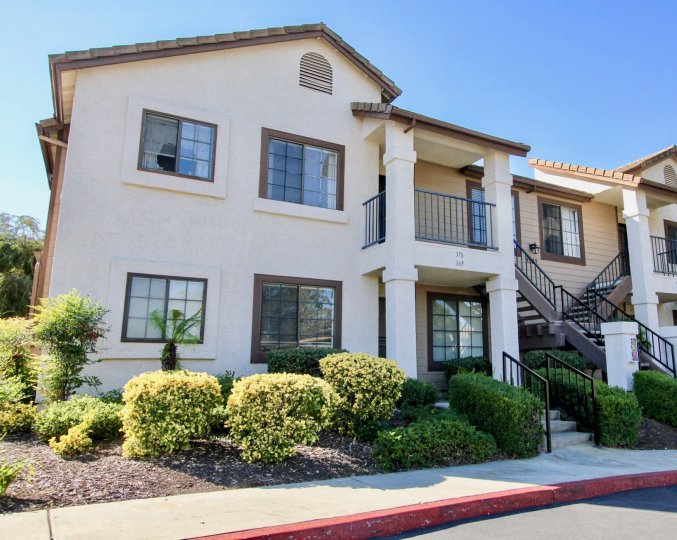 A two-storey residence with an exterior staircase in the Concord Villas community.