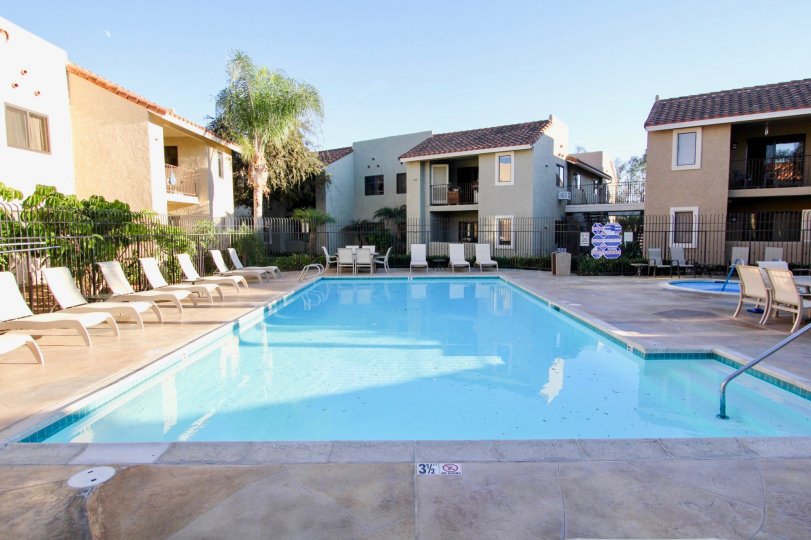 Front pool view with chairs in Jade Coast Community in Mira Mesa, CA