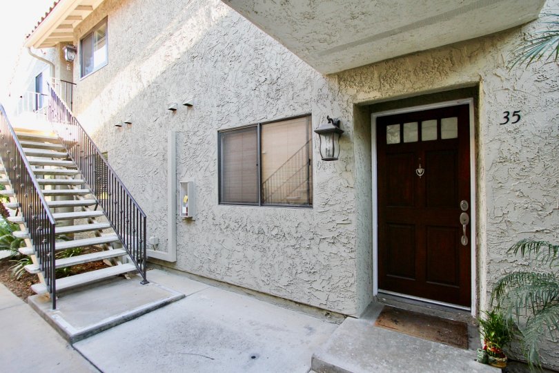 Entrance of a residence near a stairway at Jade Cost in Mira Mesa California
