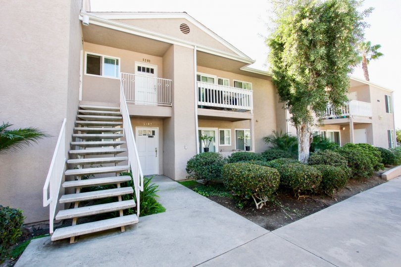 Two story residential building with attached stairway at Mirabella Point in Mira Mesa California