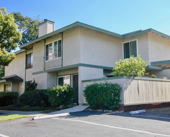 A sunny day with beautiful trees in front of a villa in Quest area of Mira Mesa