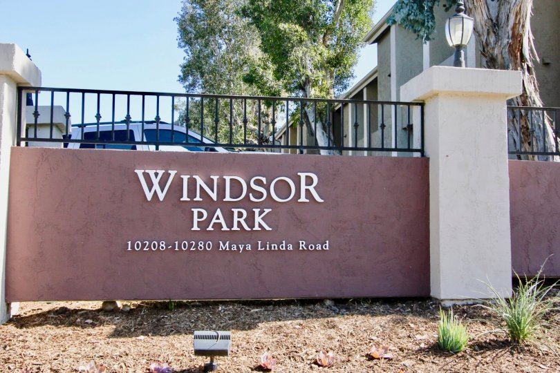 A car parked behind the entrance of Windsor Park in Mira Mesa, California