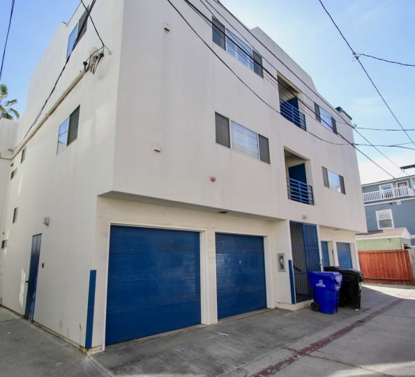 Tucked-under garages at 734 Ensenda Court in Mission Beach, California