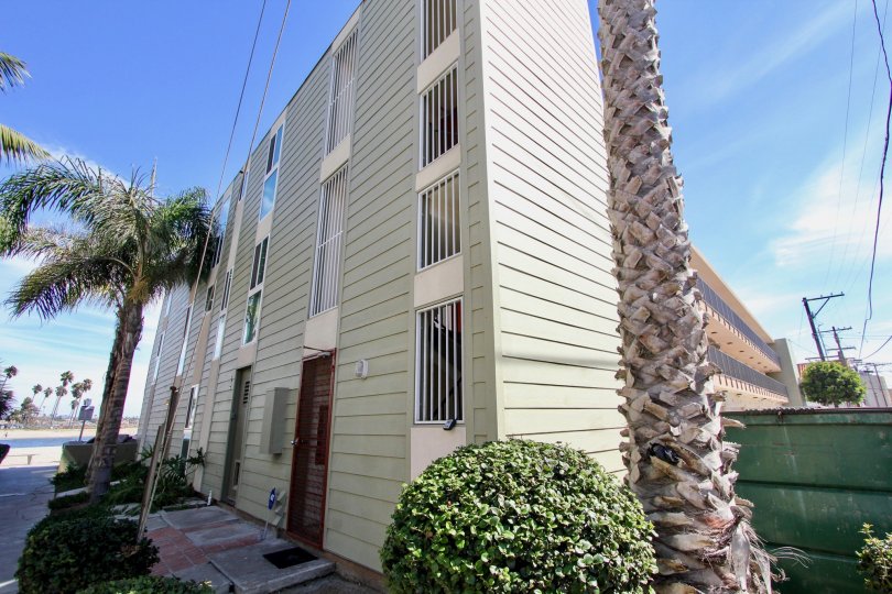 Four story residential building with barred windows at Franklin Shores in Mission Beach CA