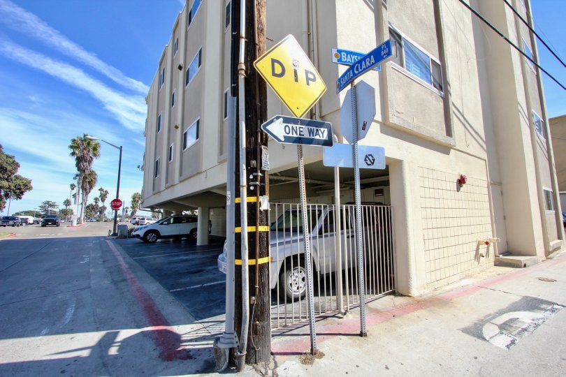 Yellow dip sing next to residential units at Santa Clara in Mission Beach CA