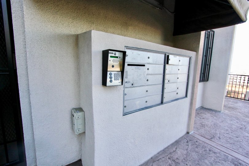 View of postal box in an residence below a balcony in the Columbia Heights