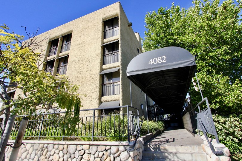 The apartment building of cresthill Plaza on a sunny day in mission hills, CA