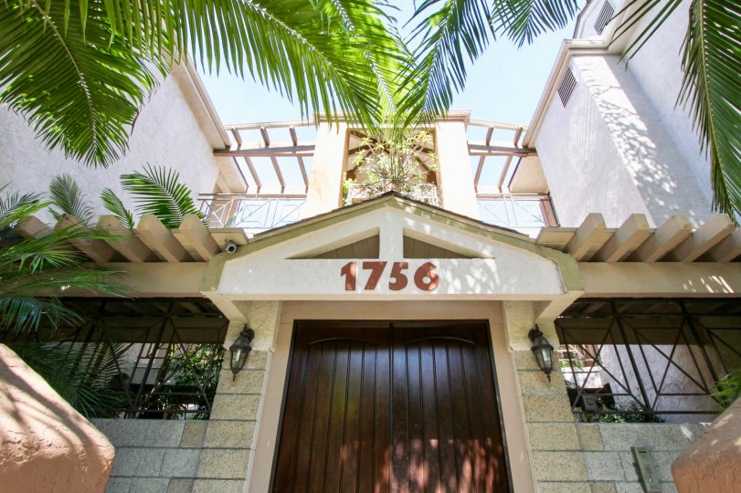 Wooden door entrance with open area and balcony in Essex Place.