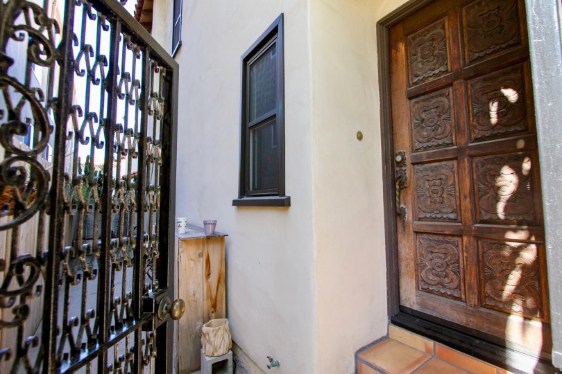 View of a beautiful wood door with several decoration in there in the Las Casas De Juan