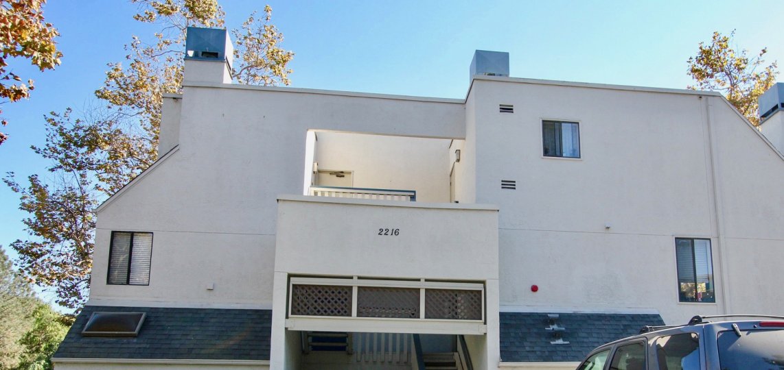 Creekwood at River Run, City: Mission Valley, backside of a building with a balcony and a car parked, nice view of the building