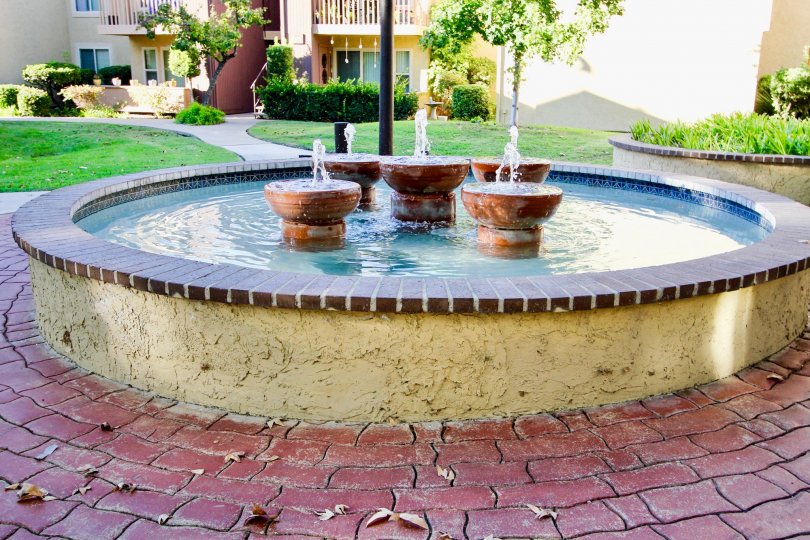 A sunny day in the area of Friars Pointe, fountain, water, brick, entrance