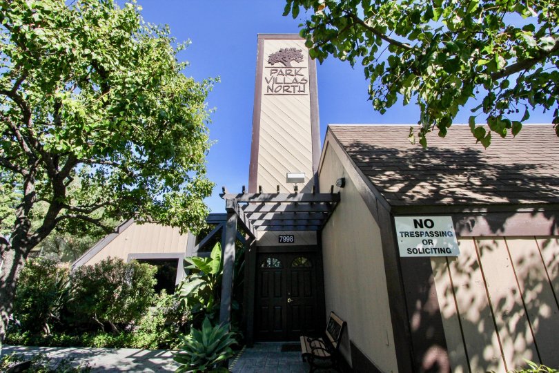 Lush trees and front landscaping of entrance to Park Villas North residence in Mission Valley.