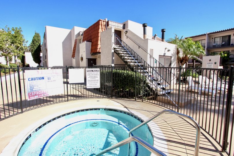 The gated hot tub on a sunny day at the Franciscan community in Mission Valley, CA.