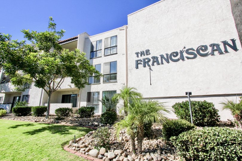 A view of The Franciscan sign and apartment buildings in Mission Valley, California