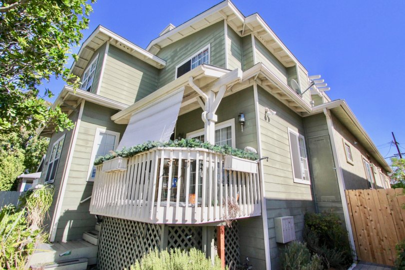 Two story gray home with a white patio located at 4755 Wilson in Normal Heights CA