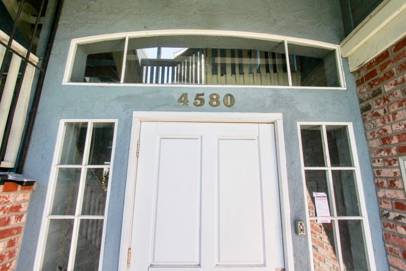 A sunny day in the area of Madison Ave, entrance, door, door bell, windows, brick