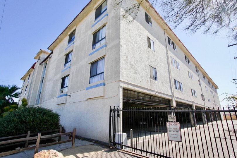A side view of a fenced-off Monroe Manor housing complex, in Normal Heights, CA.