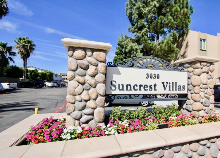 Entrance view with designed rocks pillar and garden in Suncrest Villas.