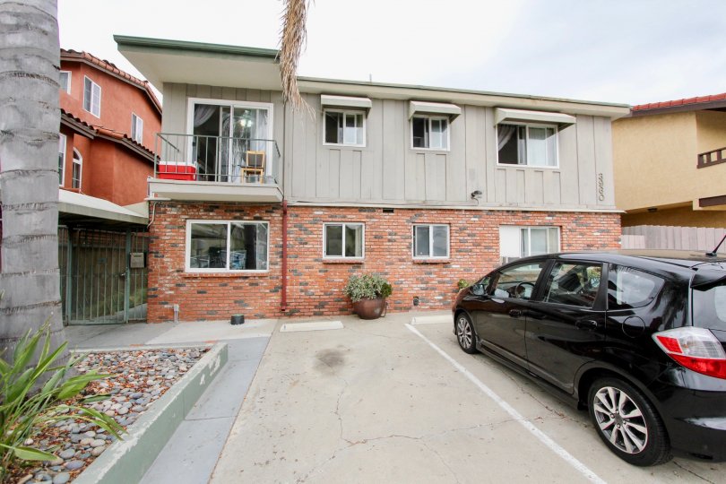 This is an exterior shot of an apartment building in the Arizona Estates Community in North Park, CA.