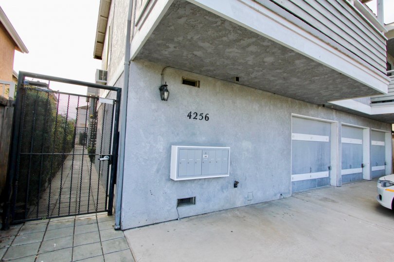 A sunny day in the area of Cherokee Oaks, condo, gated entrance, garega, car