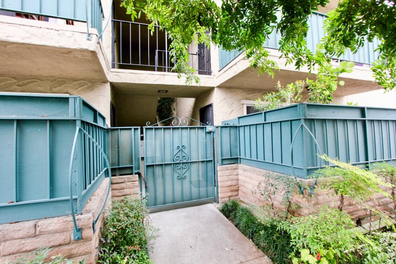 A sunny day in the area of Park Glen, condos, brick, bushes, balcony, window