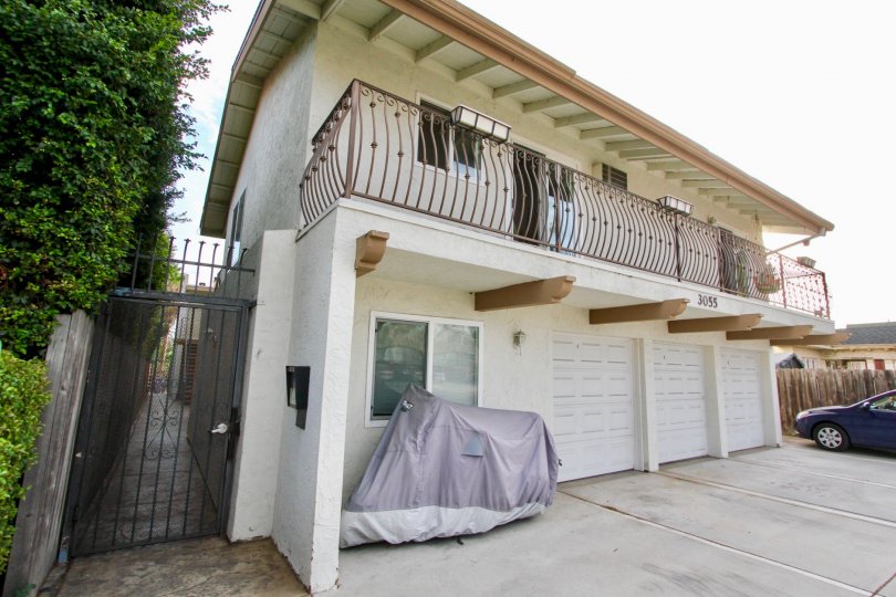 A sunny day in the area of South Park Villas, parking lot, garage, car, gated entrance