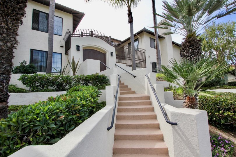 Large two-story house with gate and winiding stairs, located in Famosa Terrace, Ocean Beach, California.