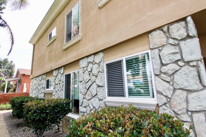 A building on a corner in the Mentone Villas area of Ocean Beach has rock walls.