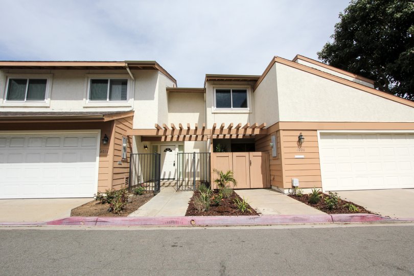 Road side view of a lovely two story duplex in Ocean Beach, California that have roomy garages and plenty of living space.