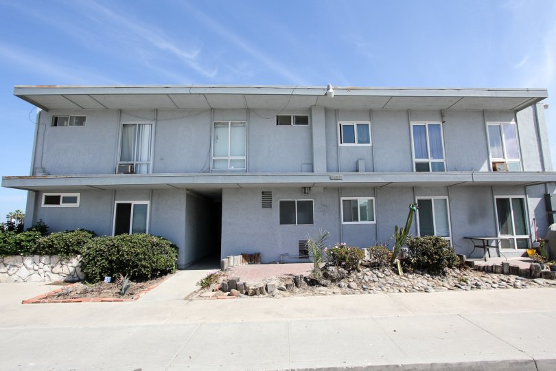 front view for the building with trees and plants in Spray
