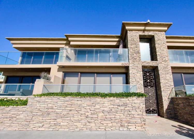 Lots of sunshine and windows at this two level home at 400 S The Strand
