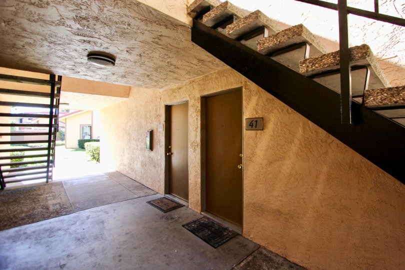 Apartment #41, located near stairs, door mat at the door