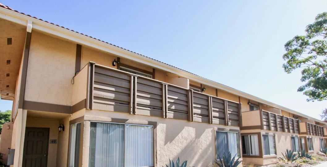 Windows and desert plants in front of units at Forest Glen in Oceanside, CA