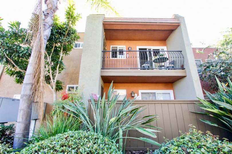 Balcony overlooking shrubbery at La Estancia in Oceanside, CA