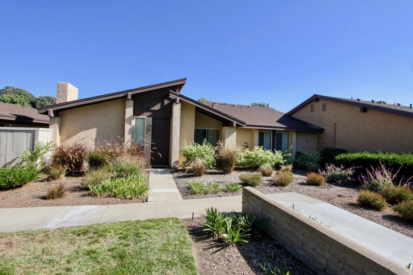 A big house with a landscaped yard in the Los Arbolitos community