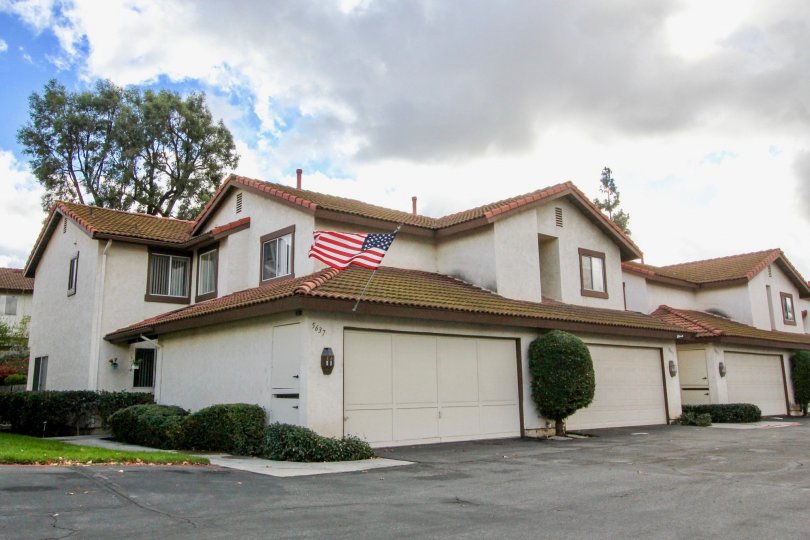 THE HOUSE IN THE MISSION MEADOWS WITH NATIONAL FLAG OF USA, PLANTS.