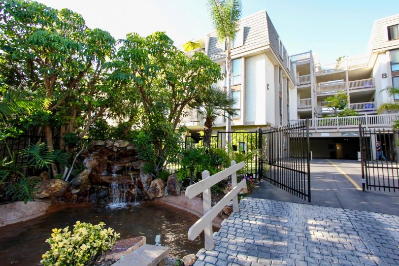 Quaint apartments in Oceanside, California with a beautiful pond by the front gates.